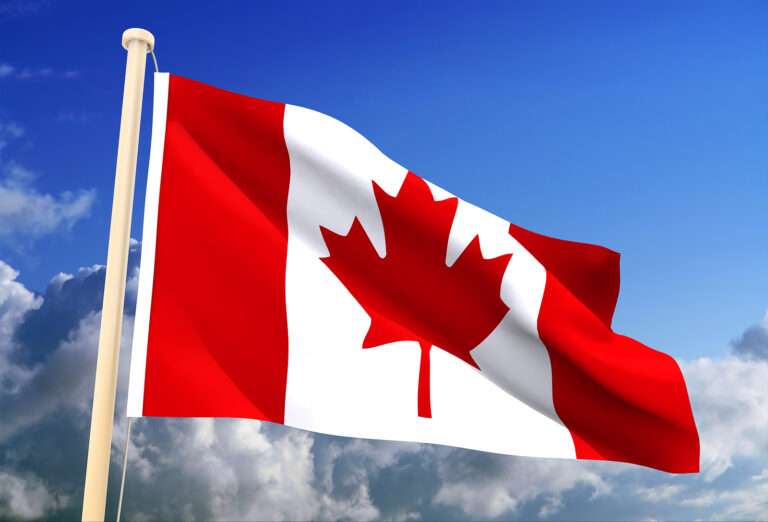 canadian flag flying in the air.