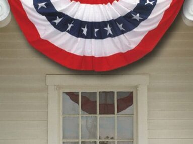 a banner flies over a window of a house