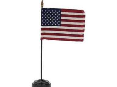 A small American stick flag on desktop base