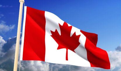 canadian flag flying in the air.