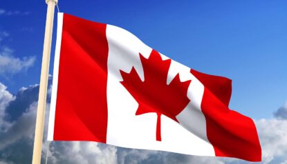 canadian flag flying in the air.